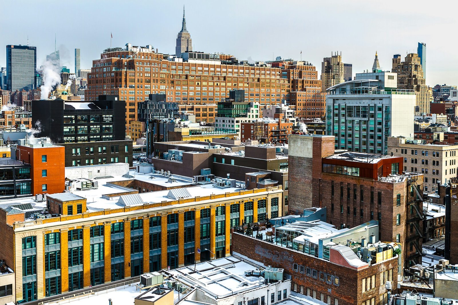 Downtown rooftops with the Empire State Building in the distance