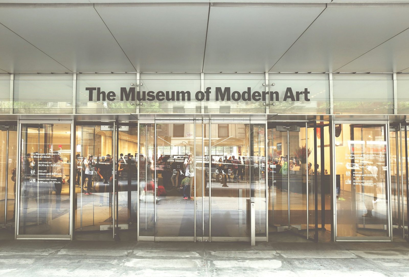 The glass entrance of The Museum of Modern Art